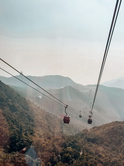 Cable cars soaring high above the mountains of North Lantau Country Park, best things to do in Hong Kong