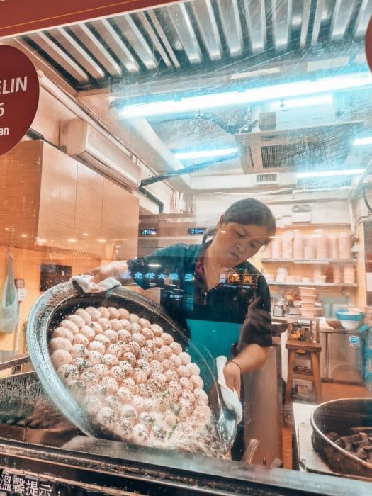 The chef preparing buns at Cheung Hing Kee Shanghai Pan-Fried Buns, Hong Kong itinerary