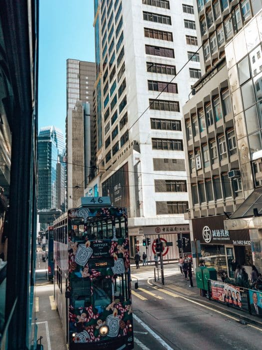 A tram riding the streets of Hong Kong Island