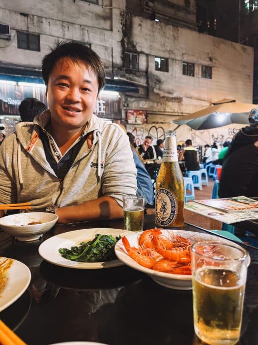 Plates of seafood and vegetables at Woosung Street Temporary Cooked Food Hawker Bazaar, Hong Kong Itinerary