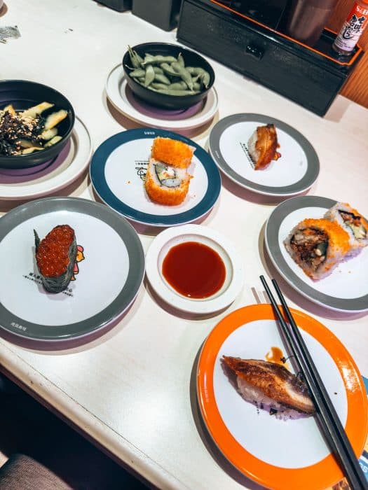 A selection of sushi on plates at Genki Sushi, Hong Kong