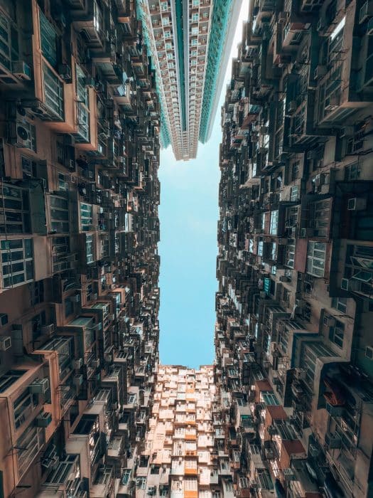 Looking up at the huge skyscrapers towering above us, Montane Mansion, Monster Building, Hong Kong Itinerary