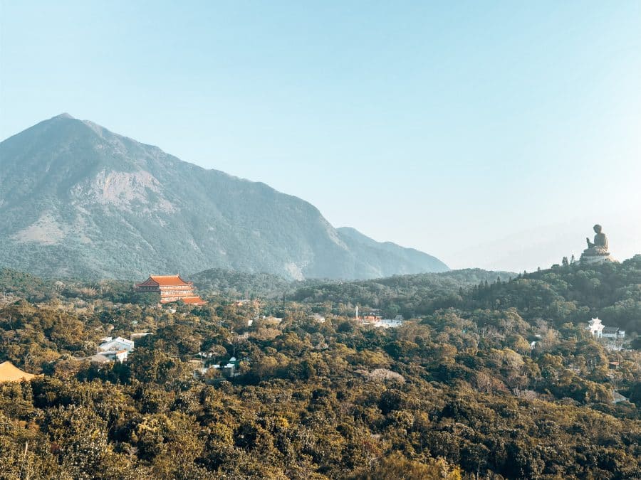 The view of Po Lin Monastery, Tian Tan Buddha and surrounding mountains from Ngong Ping Viewing Platform, Lantau Island, Hong Kong Itinerary