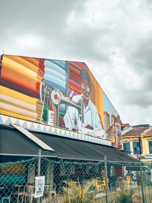 Bright coloured street art on the side of a building in Little India, Singapore Itinerary