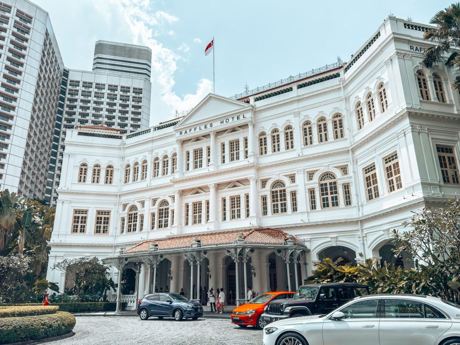 The grand white exterior of Raffles Hotel, Singapore Itinerary
