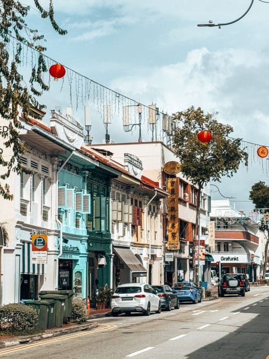 Traditional shophouses line a road and red lanterns hang across it, Joo Chiat Road, Peranakan Houses, Katong Joo Chiat, Singapore Itinerary