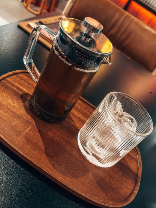 A pot of tea with a glass of ice water at King's Cart Coffee Factory, Katong Joo Chiat, Singapore Itinerary