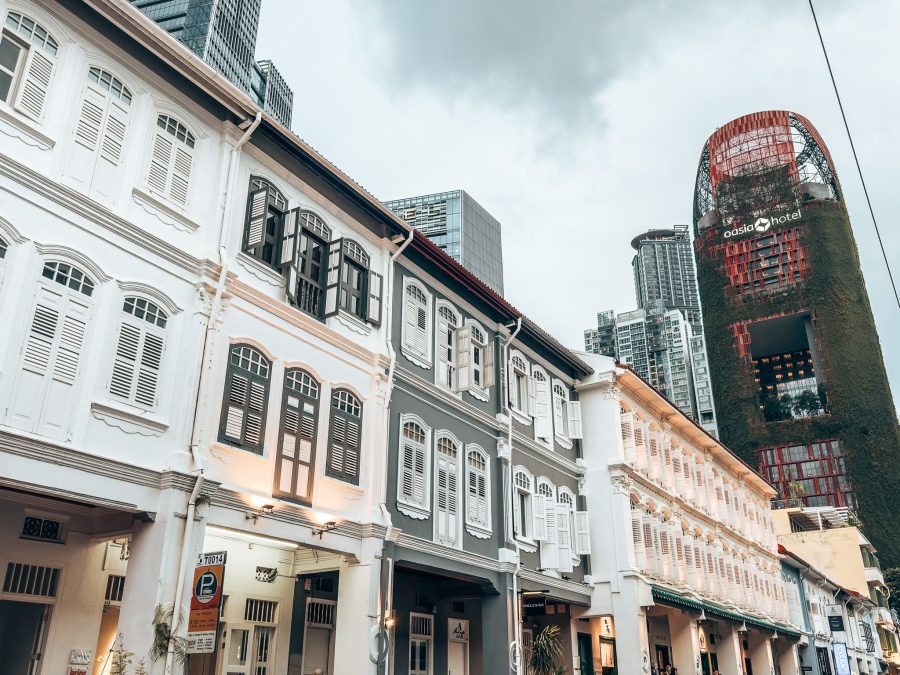 Traditional shophouses of Chinatown with skyscrapers towering behind them, 3-Day Singapore itinerary