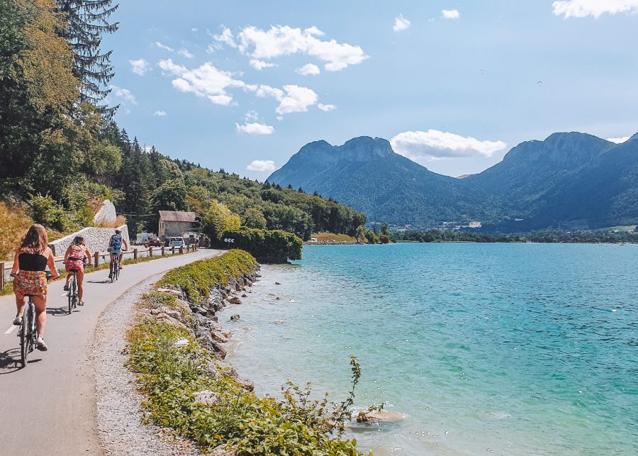 Helen and friends cycling around Lake Annecy with a dramatic mountain backdrop, best things to do in Annecy, France
