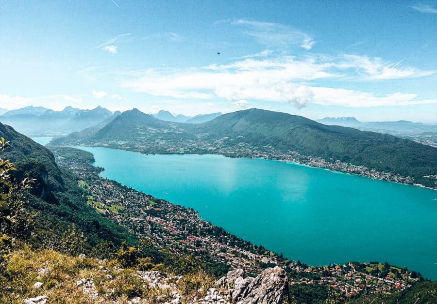 View over Lake Annecy from the top of a mountain, hiking in Annecy in summer, France