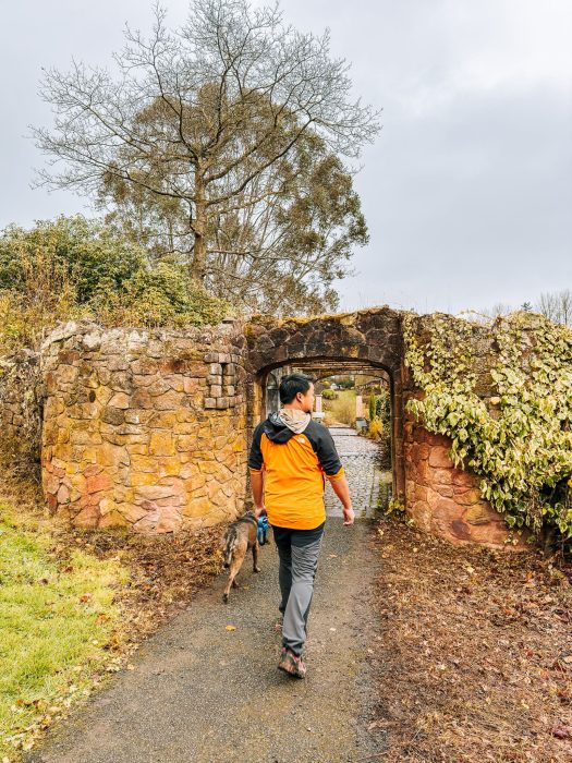 Andy walking through stonework along the Folly Trail at the Tawny Hotel, best luxury hotels in Staffordshire