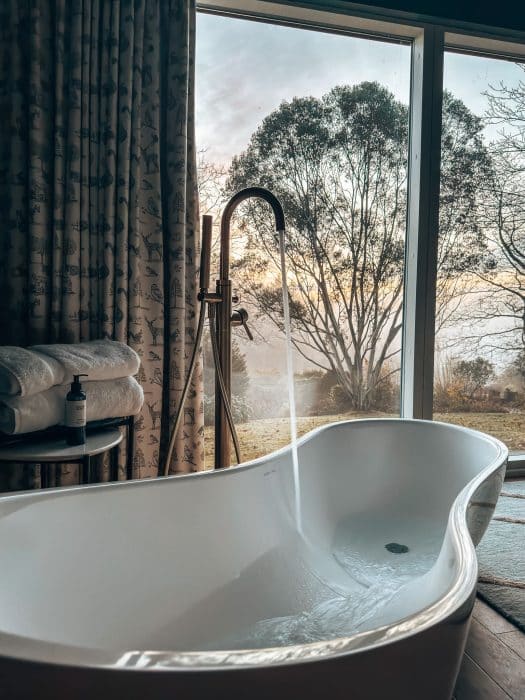 A free-standing bathtub looking across the estate at the Lookouts, the Tawny Hotel, best hotels in Staffordshire