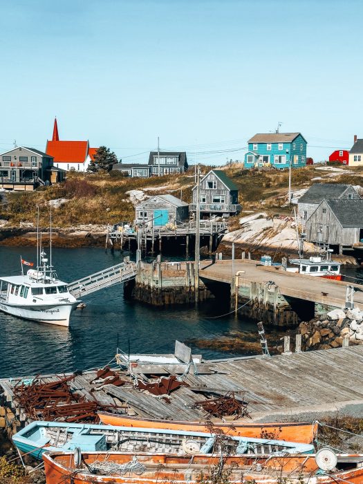 Colourful houses and fishing boats in the sea at Peggy's Cove, Best Places to Visit in Nova Scotia, Canada