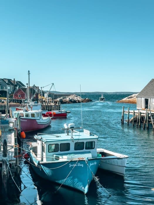 Fishing boats in the ocean, Peggy's Cove, best places to visit in Nova Scotia, Canada