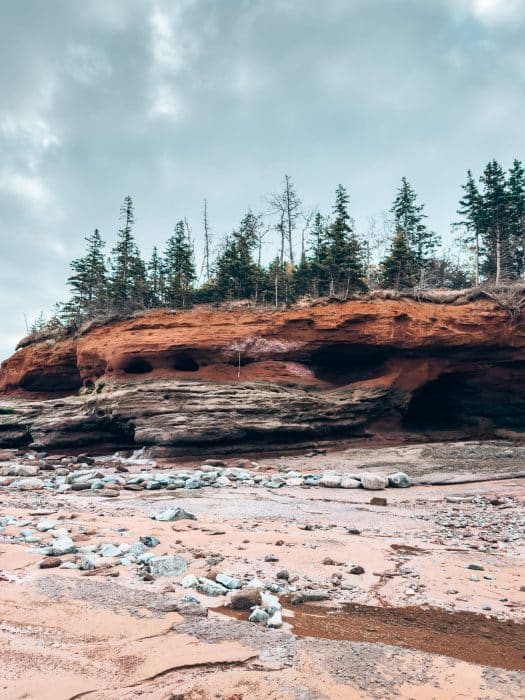 A striking red rock at Burntcoat Head Park, Places to Visit in Nova Scotia, Canada