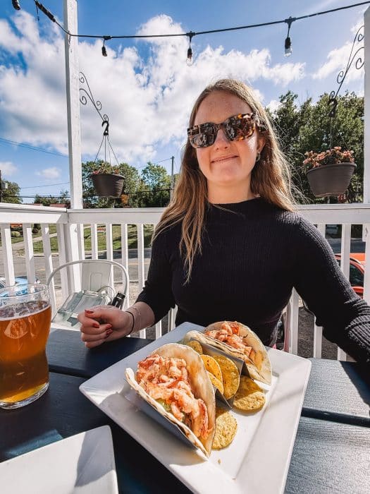 Helen eating lobster tacos at Main Street Restaurant, Ingonish, Cabot Trail, Nova Scotia