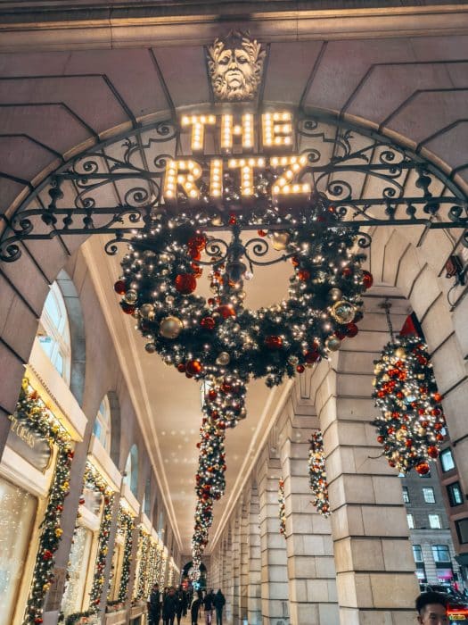 Red and gold Christmas lights at The Ritz, London Christmas lights walking route