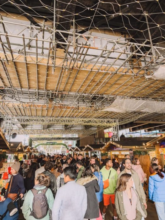 Market stalls and lots of people at South Bank Winter Market, best places to visit in London at Christmas