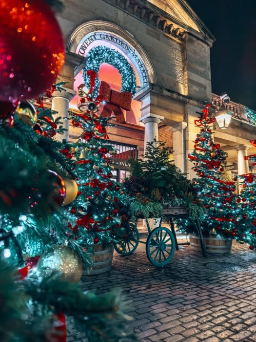 Several Christmas trees at the Market Building in Covent Garden Christmas tree, London Christmas lights walking route