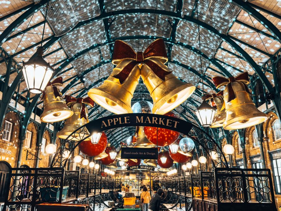 Huge gold bells with red bows hanging from the Market Building in Covent Garden at Christmas, best things to do in London