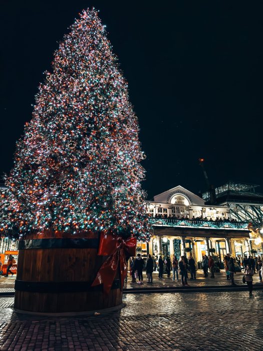 A huge colourful sparkling Christmas tree in Covent Garden Christmas tree, London Christmas lights walking route